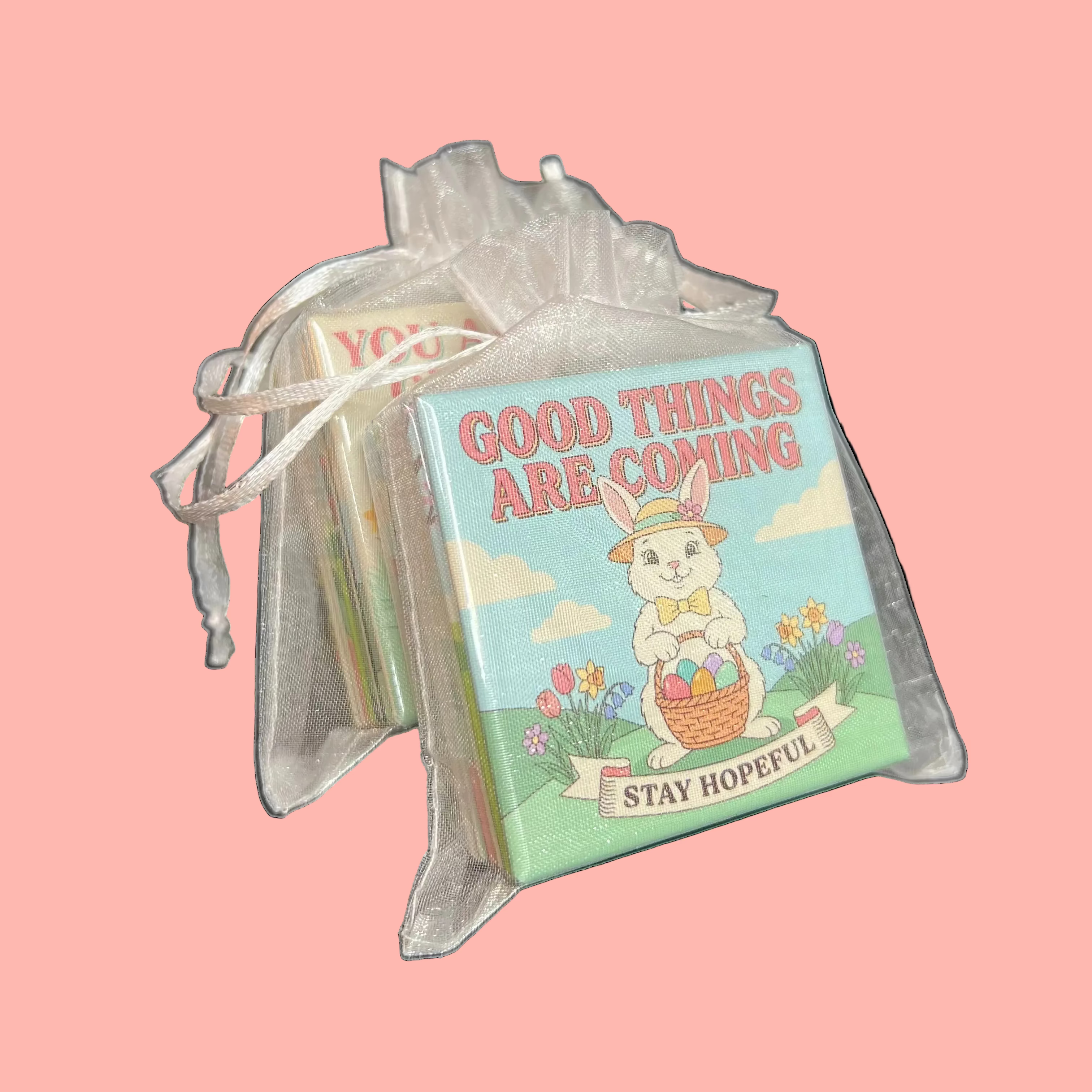 Spellbound Magnet Co. Easter 2026 Magnet Pack stacked inside a sheer white organza gift bag with the Good Things Are Coming / Stay Hopeful design facing forward, shown against a dark background.