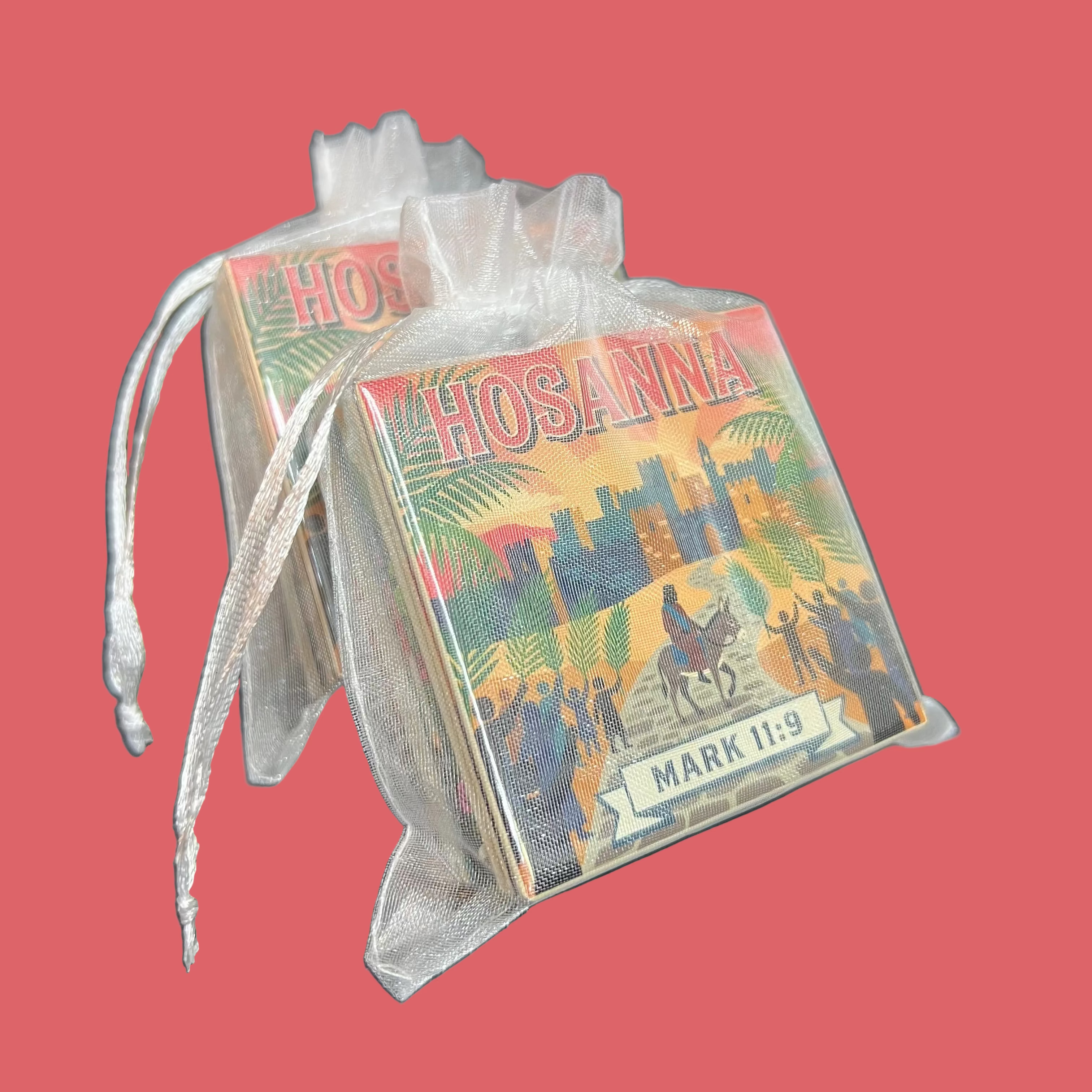 Spellbound Magnet Co. Easter Faith 2026 Magnet Pack stacked inside a sheer white organza gift bag with the Hosanna / Mark 11:9 design facing forward, shown against a dark background.