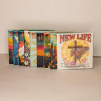 Nine Spellbound Magnet Co. Easter Faith 2026 Magnet Pack magnets fanned and stacked upright against a warm neutral background, with the New Life / 2 Corinthians 5:17 design facing forward and the colorful edges of the remaining eight designs visible behind it.